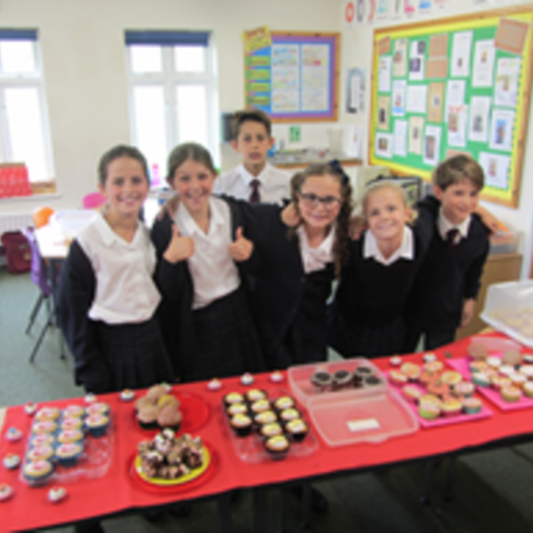 Will and his team raise money with a cake sale