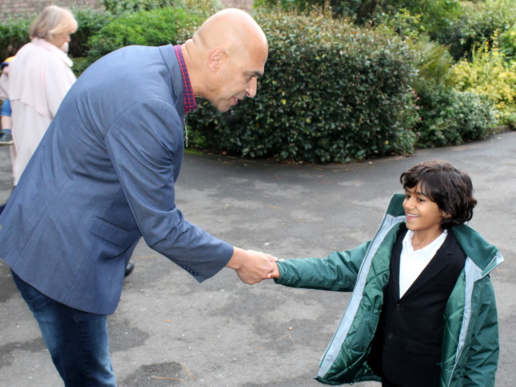 Kieran welcoming a parent in the morning