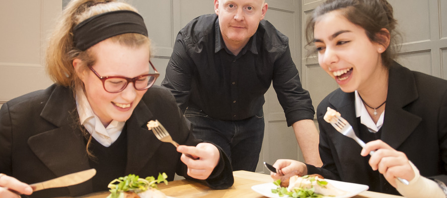 Pupils tuck into chef Ben McKellar's salmon and sweet potato cakes