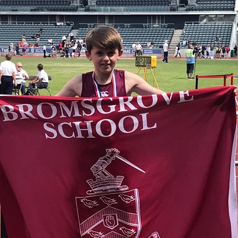 Oliver D with flag National Prep School Championships