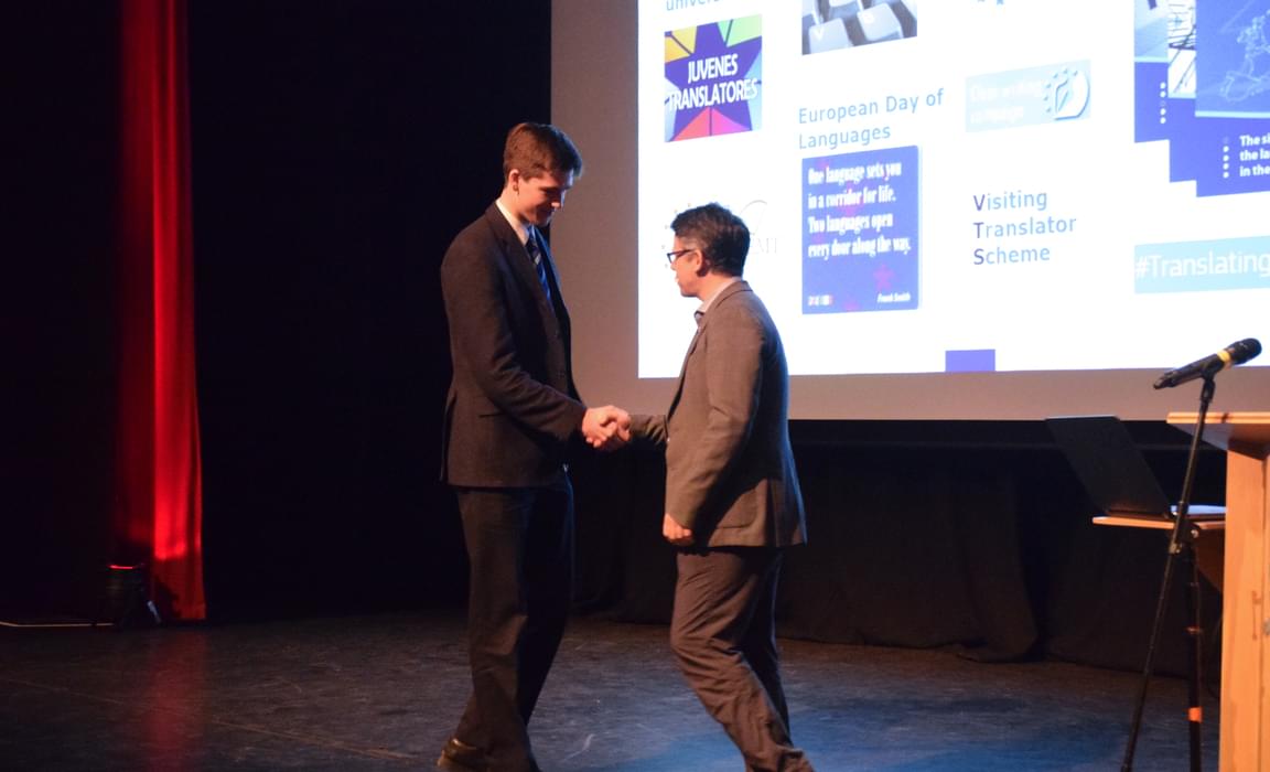 Oliver receiving his award