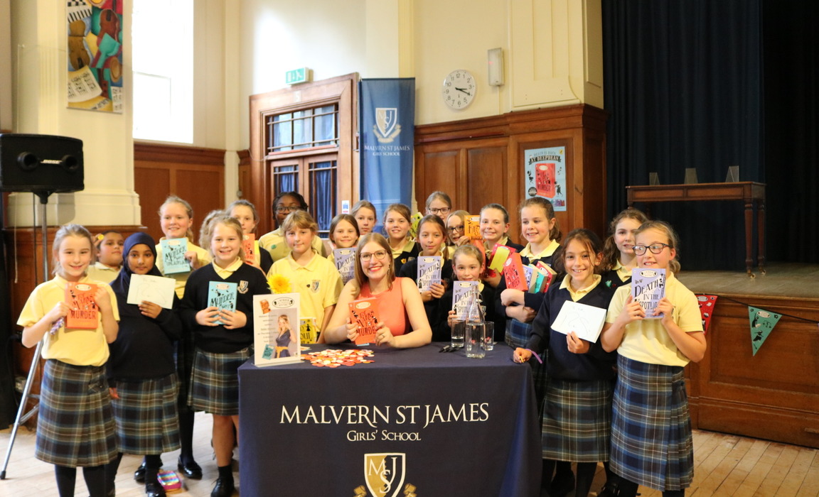 Year 5 and 6 girls from MSJ with Robin after having their books signed by the author