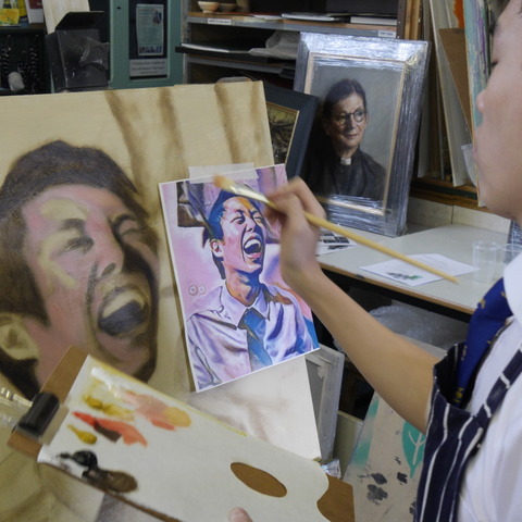 Agassiz Chan works on his portrait during the two-day painting workshop in Monmouth.