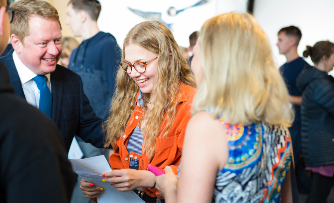 RGS Headmaster Shaun Fenton shares in the delight of a happy pupil and her parents