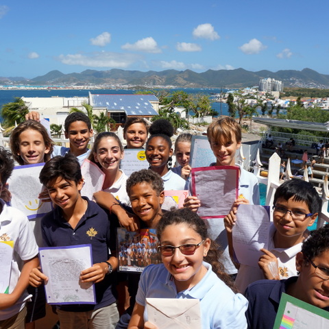 Pupils at the Caribbean International Academy in St Maartens with the letters of support from the girls at Saint Martin’s School over 4,000 miles away