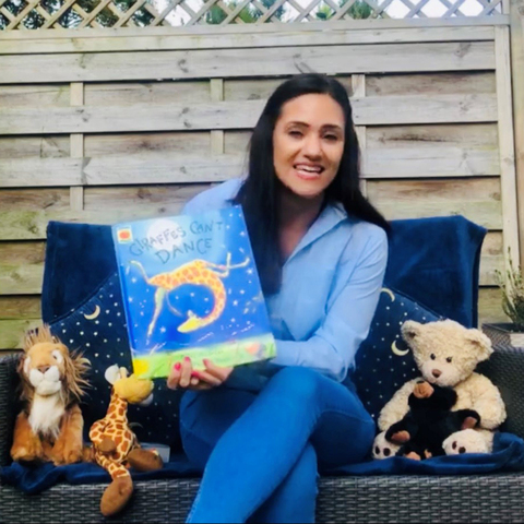 Miss Hassan reading Giraffes can't Dance