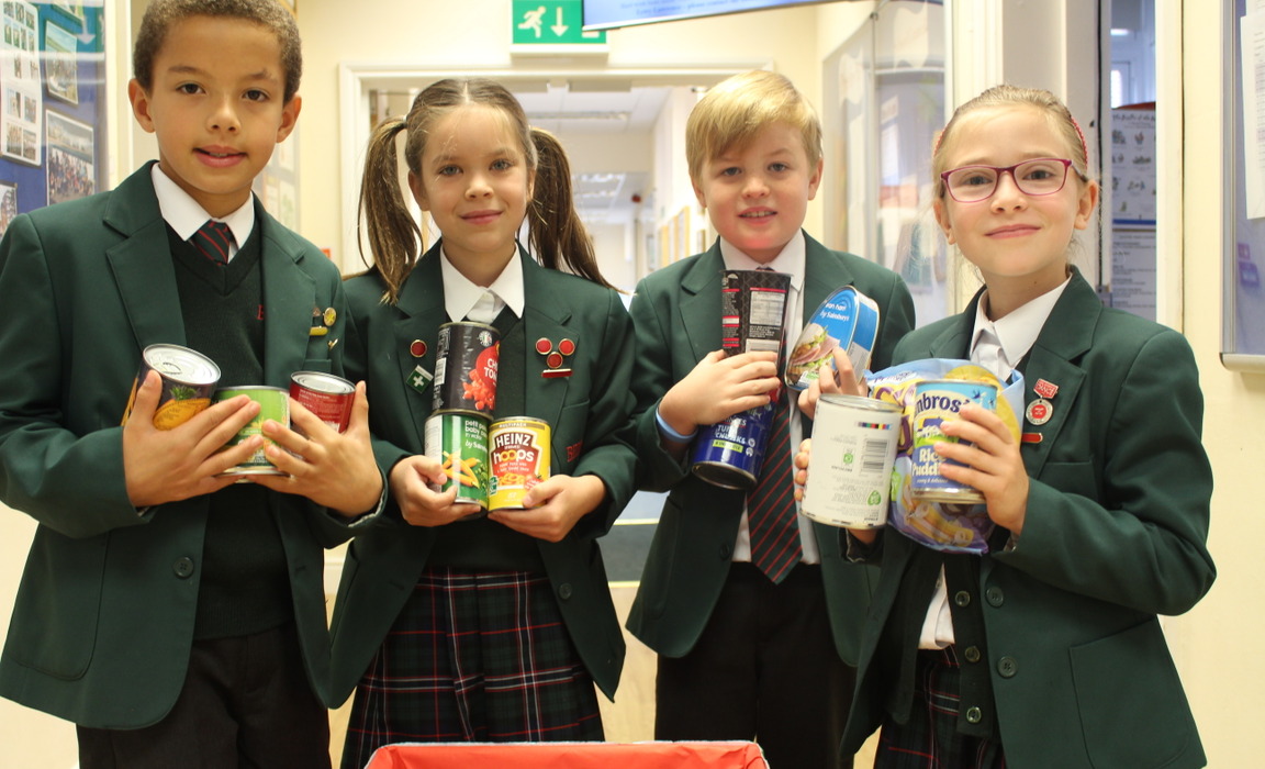 Pictured are Bede’s Prep pupils with some of the items of food collected for the School’s Harvest Festival