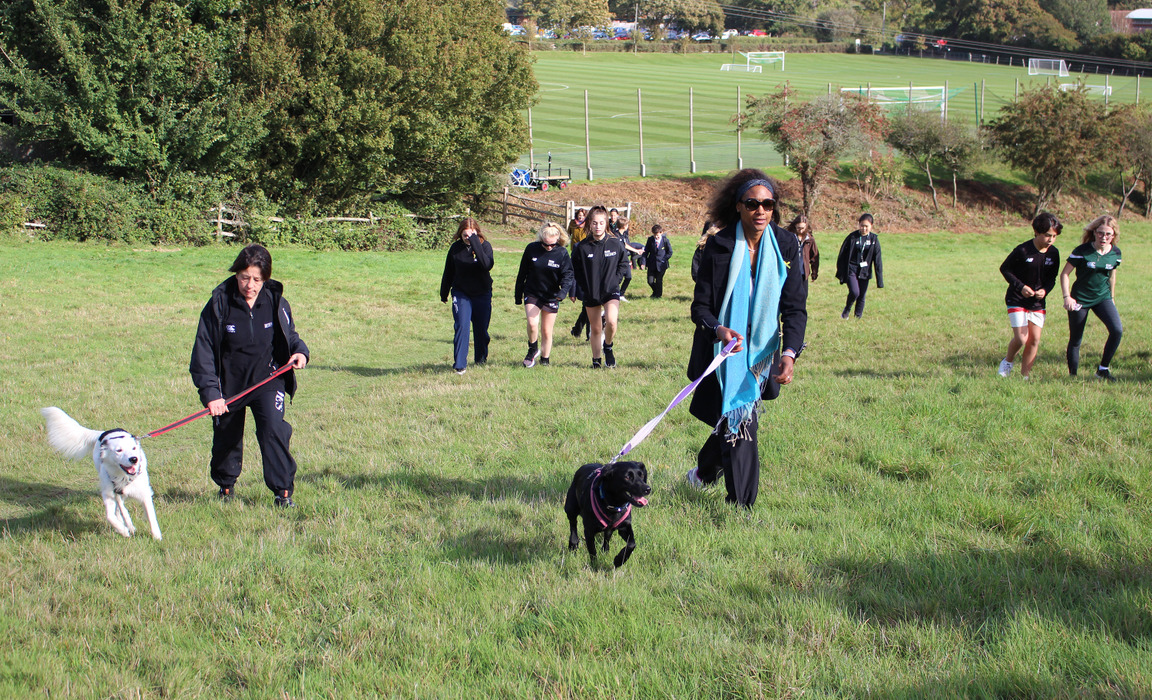 Bede’s pupils and staff on their wellbeing dog walk in aid of World Mental Health Day