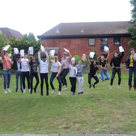St John's College A Level students jumping for joy