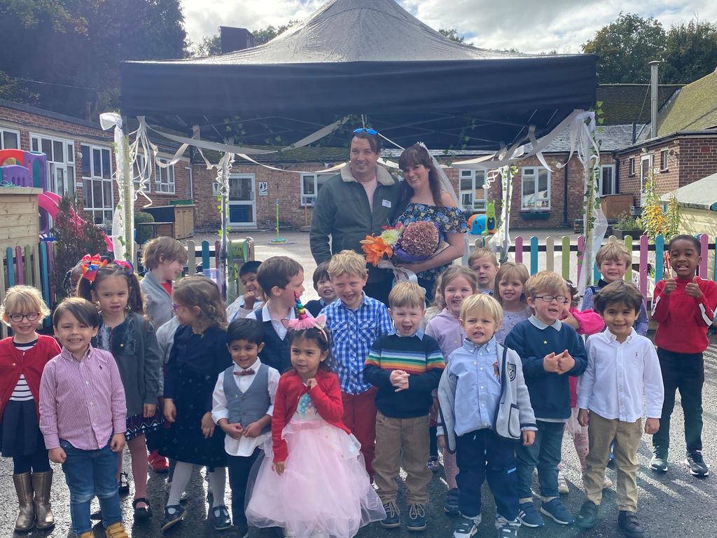 Miss O'Brien and Mr Jack celebrate with the Reception Class