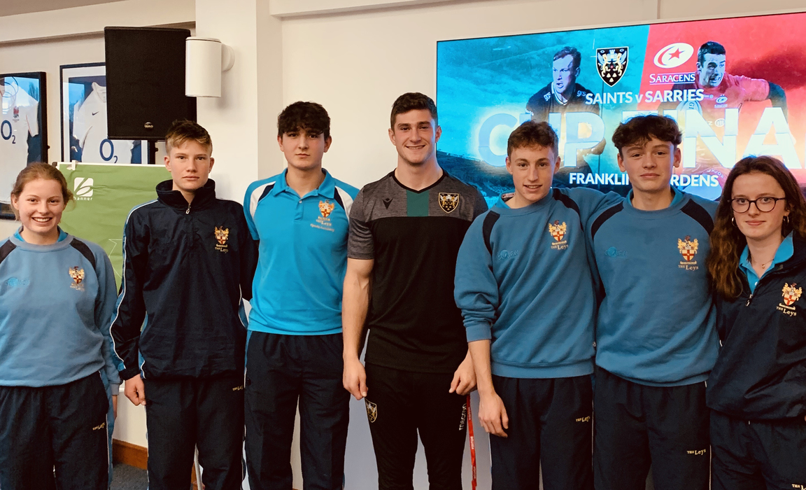 James Grayson from the Northampton Saints with members of The Leys Sport Academy.