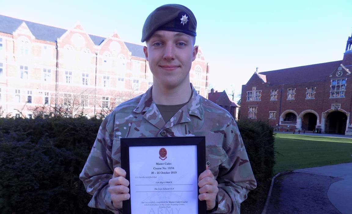 James L with his certificate for his Highly Competent completion of the Master Cadet CCF course.