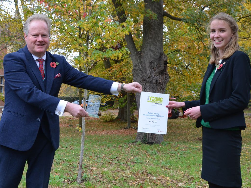 Martin Priestley presents Charlotte with her award.