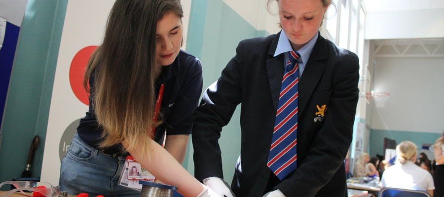 The team from SERCO help students get hands-on with wire locking