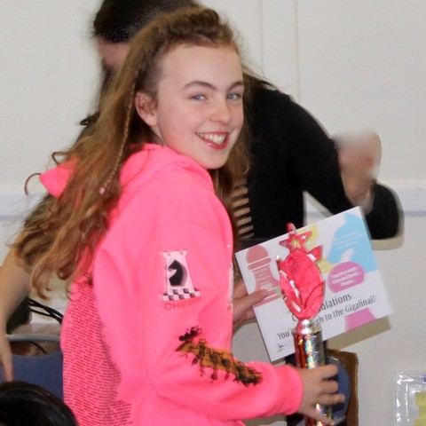 Grace Morgan collects her winning trophy