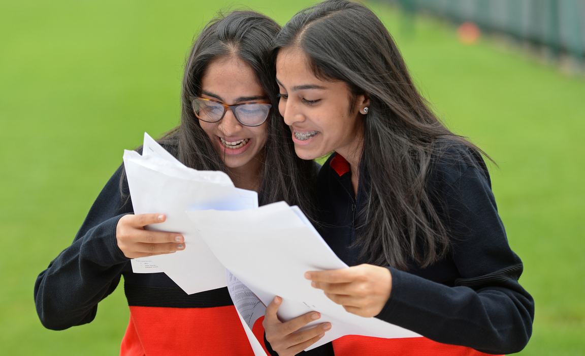 Withington Girls' School pupils Imaan (L) and Safa (R) finding out they had identical GCSE results